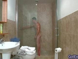 Fabulous muscled bloke jerking under shower